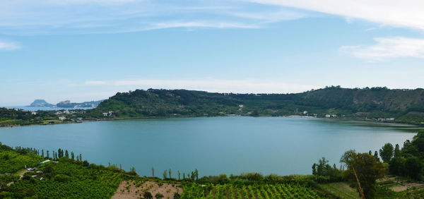 Scenic view of lake against cloudy sky