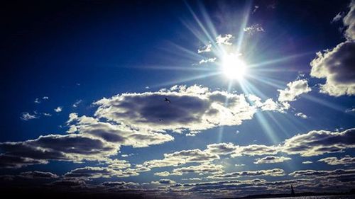 Sun shining through clouds