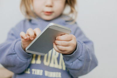 Midsection of woman using mobile phone