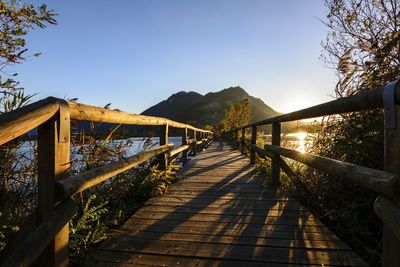 Pier over lake against mountain