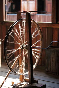 Close-up of old wheel on table