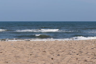 Scenic view of beach against clear sky