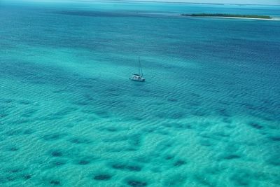 High angle view of sailboat sailing on sea against sky