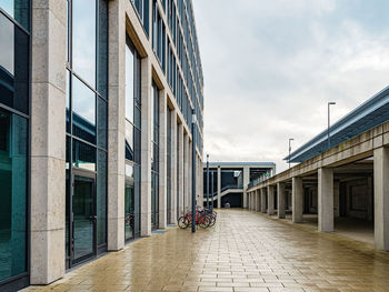 Street amidst buildings in city against sky