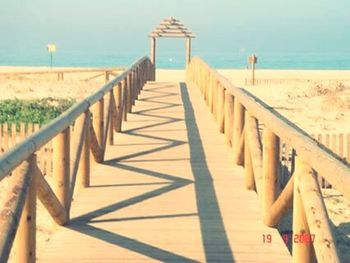 Pier on sea against sky