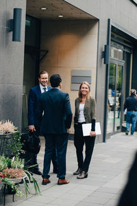 Group of people standing against building