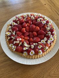 High angle view of chopped fruits in plate on table