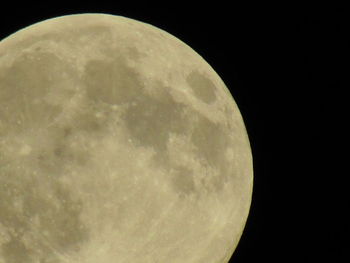 Low angle view of moon against clear sky at night