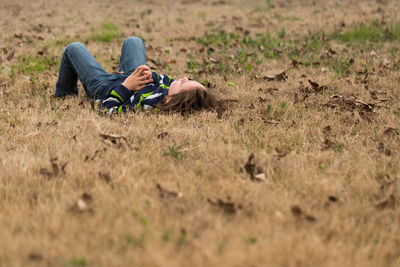 Full length of girl lying on grass