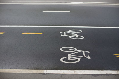 High angle view of arrow sign on road