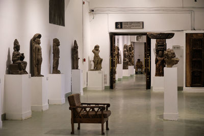 Empty chairs and tables in building