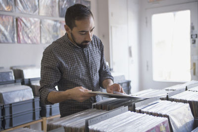 Young man shopping for records