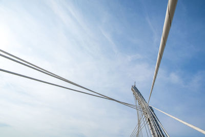 Low angle view of cables against sky