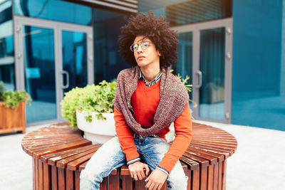 Young man sitting on seat