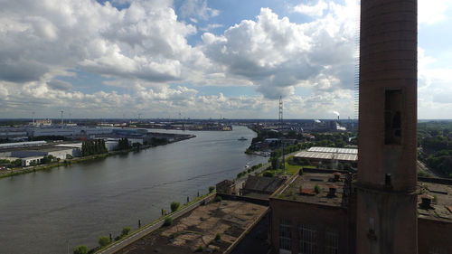 View of buildings against cloudy sky