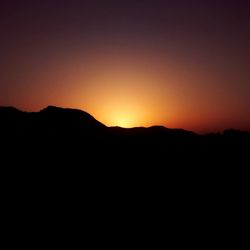 Scenic view of mountains at sunset