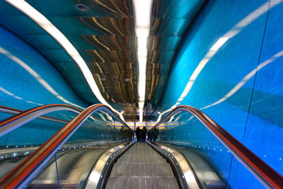 Illuminated tunnel at subway station