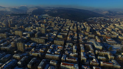 High angle view of city lit up at night