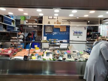 Group of people working at store