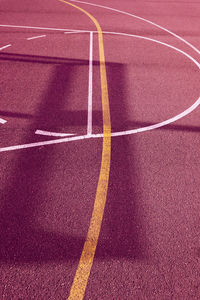 Silhouette on the red street basket court