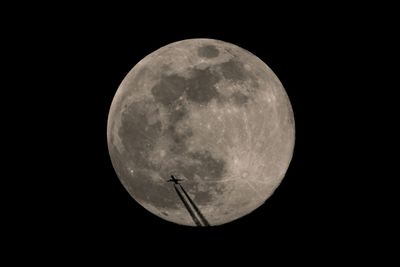 Scenic view of moon against sky at night