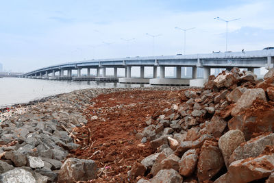 Bridge over river against sky