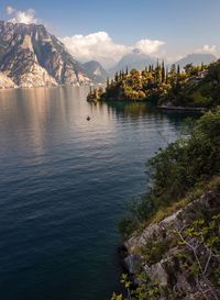 Scenic view of lake and mountains against sky