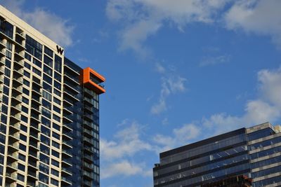 Low angle view of office building against sky