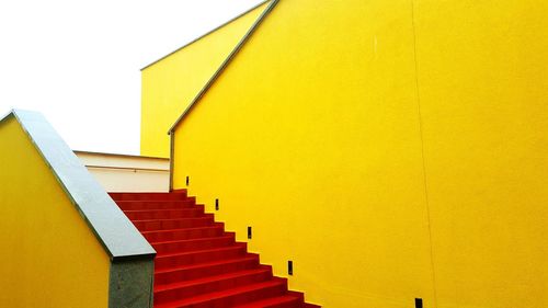 Red steps of yellow building
