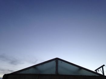 Low angle view of built structure against blue sky