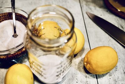 High angle view of fruits in jar on table