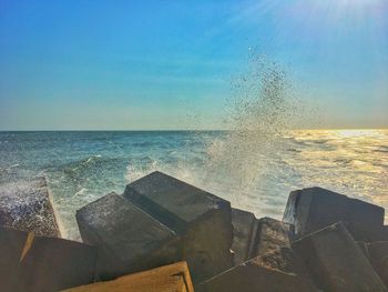 Scenic view of sea against clear blue sky