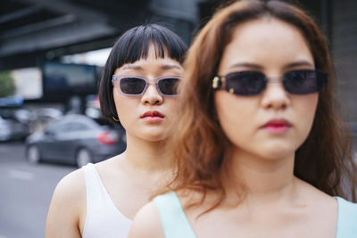 Portrait of beautiful young woman wearing sunglasses