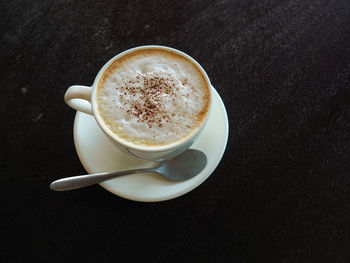 High angle view of coffee cup on table