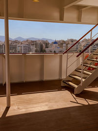Buildings against sky seen through glass window