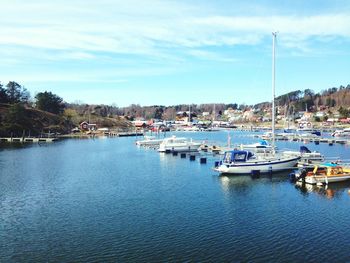 Boats moored at harbor