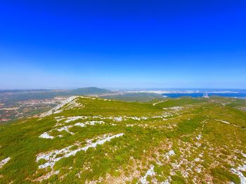 Scenic view of landscape against clear blue sky