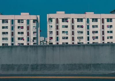 Concrete road divider against buildings