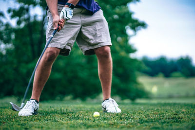 Low section of person on golf course