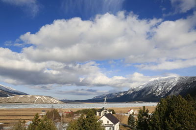 Scenic view of landscape and mountains against sky