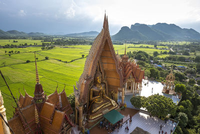 Panoramic view of temple amidst buildings against sky