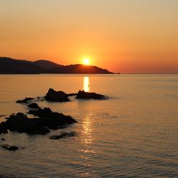 Scenic view of sea against sky during sunset