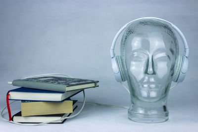 Close-up of sculpture on table against white background