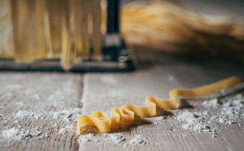 Close-up of pasta maker on table