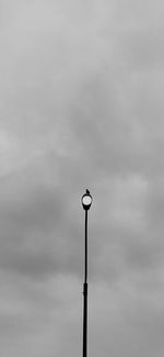 Low angle view of street light against sky