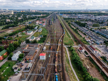 Aerial view of railways. train with cargo. sorting station. freight wagons with goods on railroad.