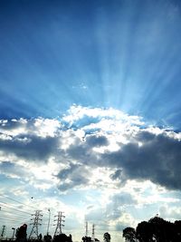 Low angle view of people against sky