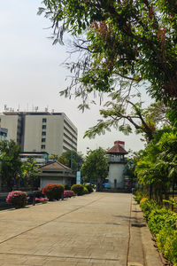 View of street amidst buildings against sky