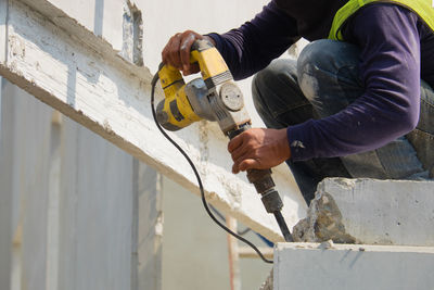 Midsection of worker working at construction site