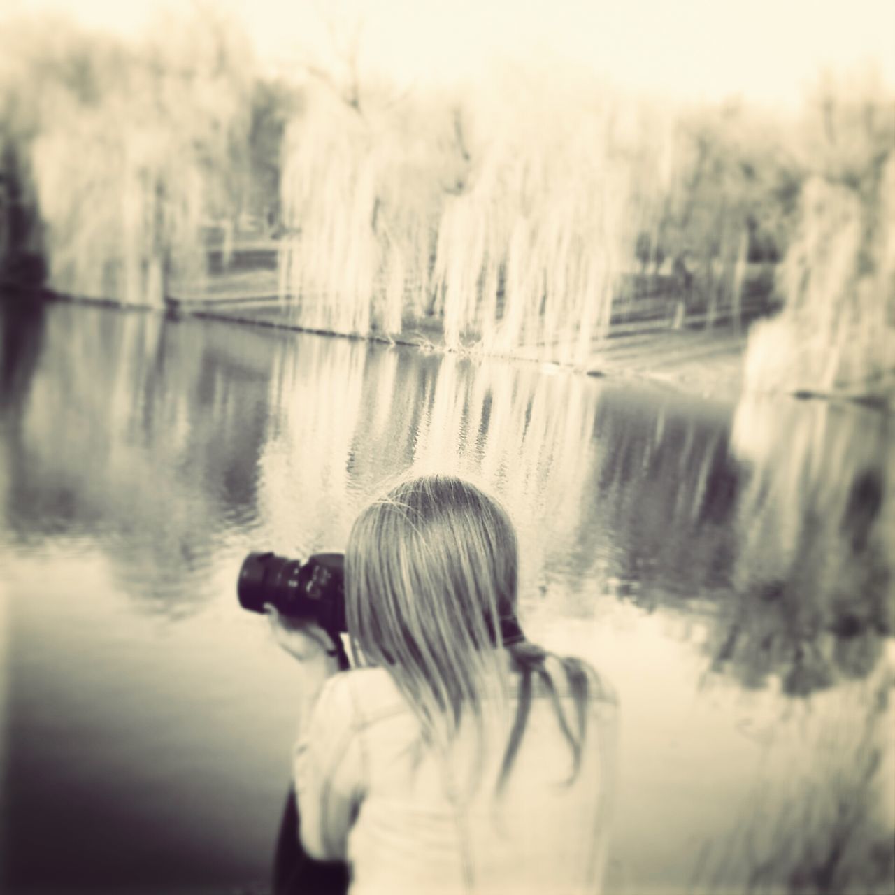 lifestyles, leisure activity, water, rear view, waist up, lake, casual clothing, standing, reflection, three quarter length, focus on foreground, person, childhood, headshot, tree, girls, young adult, elementary age